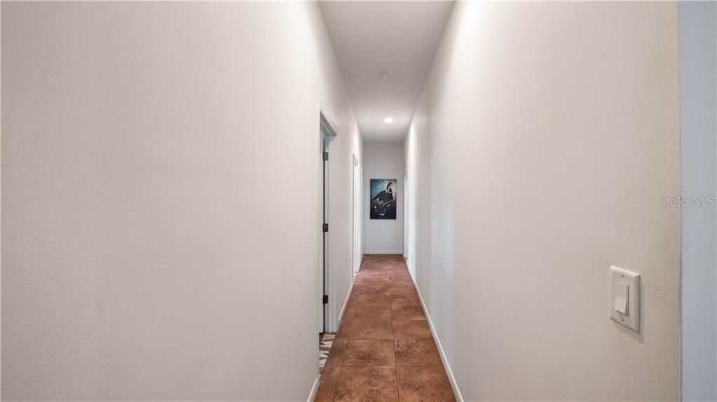 Hallway leading into Secondary Bedrooms and one of the Bathrooms on First Floor