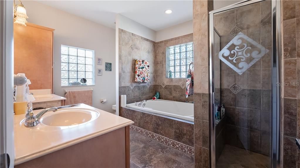 En-Suite Master Bath with Double Vanity, Oversized Jacuzzi tub and Separate Walk-in Showier