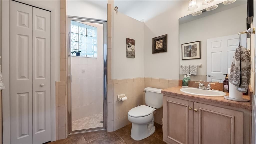 Bathroom #3 - first floor - walk-in shower, linen closet, toilet and vanity sink