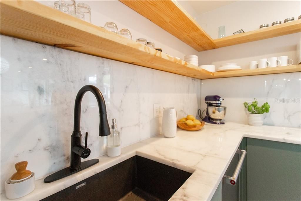 Beautiful open shelves and marble countertops
