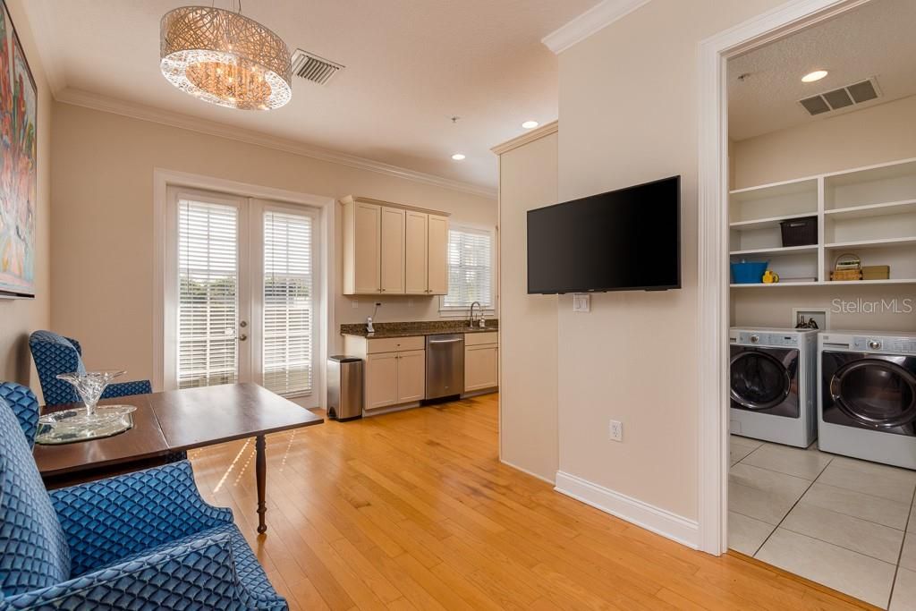 Kitchen has eat in space, French doors to rear balcony, walk-in pantry and laundry area.