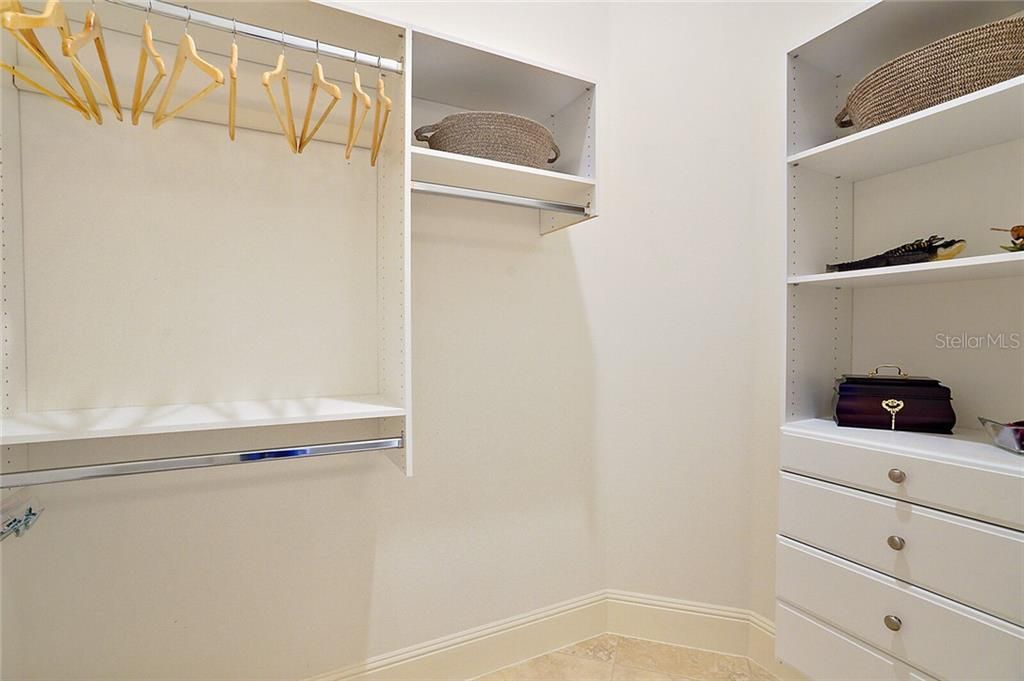 Custom closet system in guest suite ~