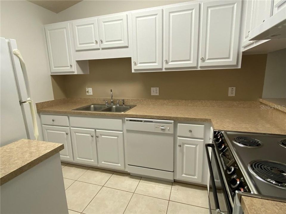 Updated kitchen with stove, refrig, dishwasher, garbage disposal
