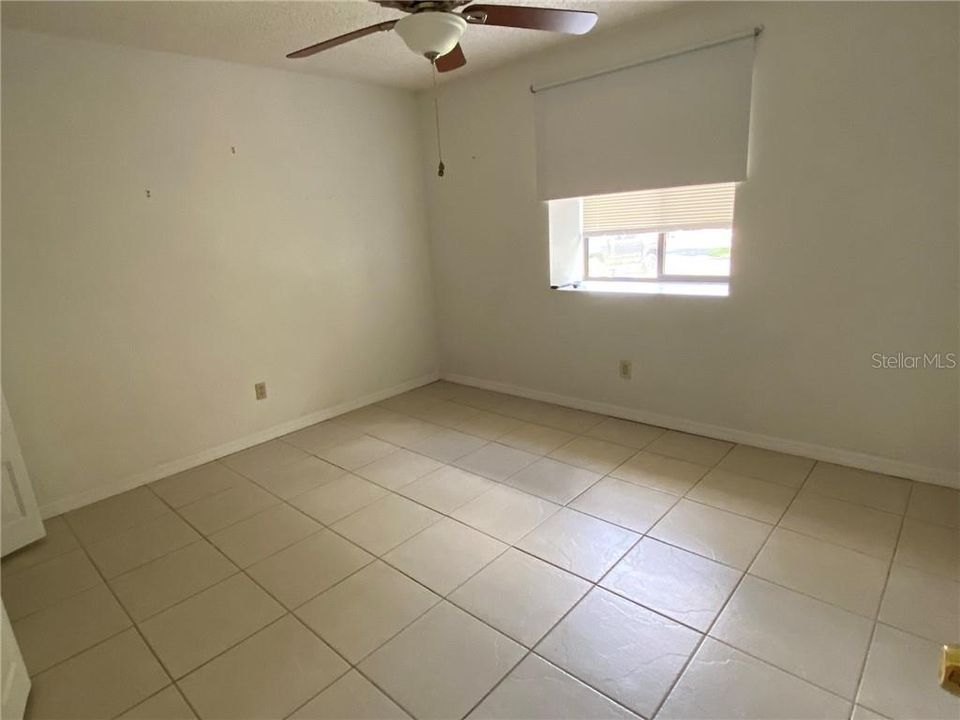 Front bedroom with tile flooring