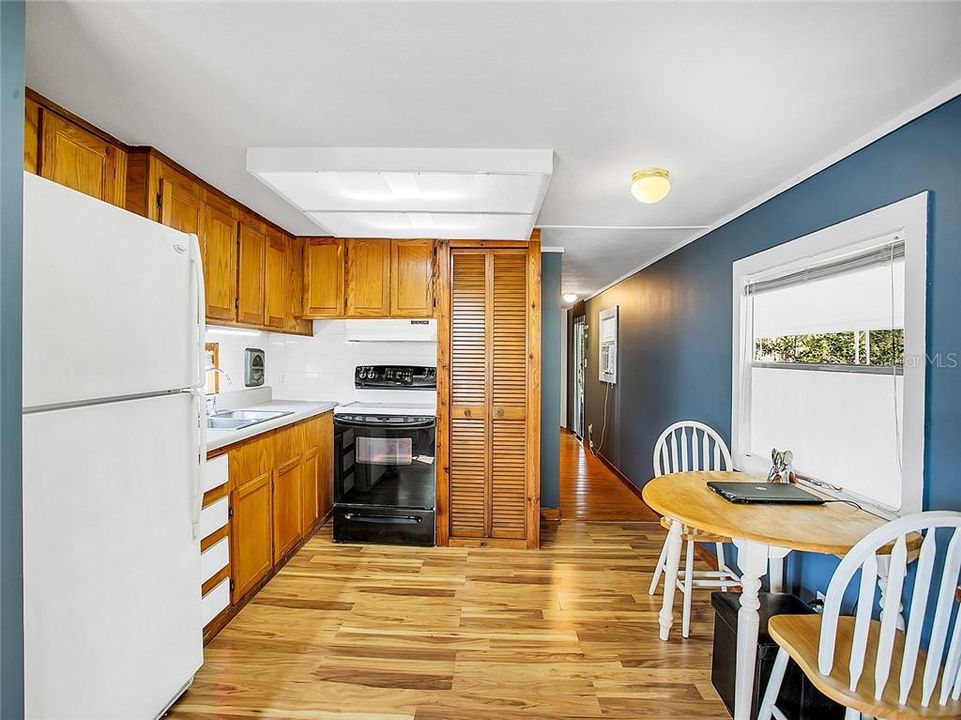 Cozy eat-in kitchen offers solid wood cabinets & closet pantry for ample storage.