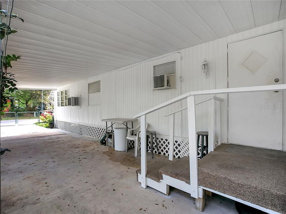 Enjoy the covered carport with deck