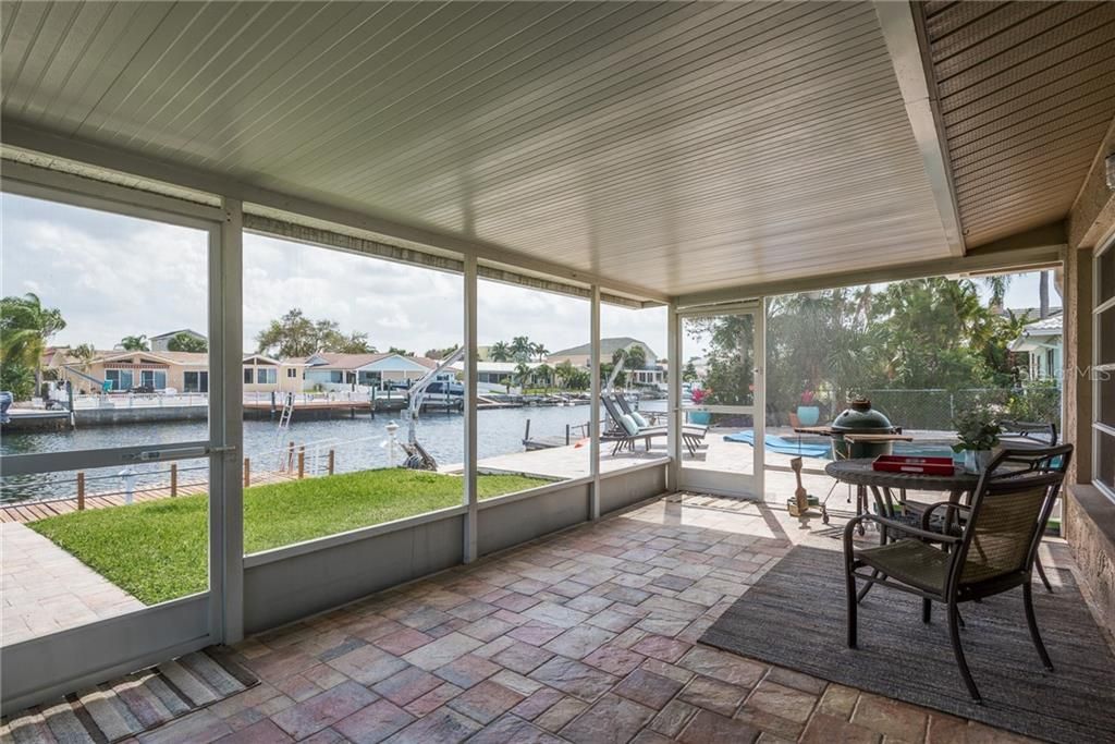 Screened in lanai with great view of the canal and access to the pool.