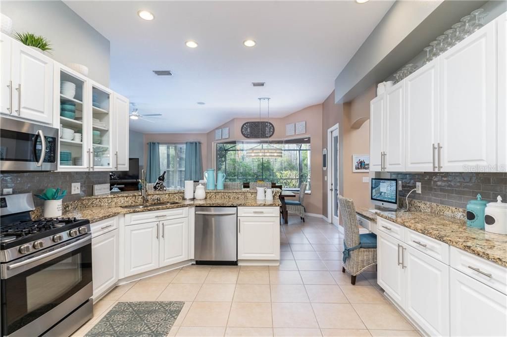 updated kitchen with granite counter tops, stainless steel appliances.