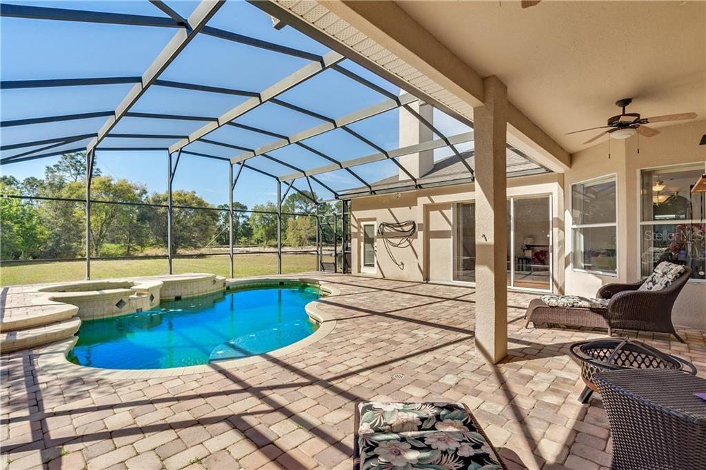 Covered patio and screened in pool/spa