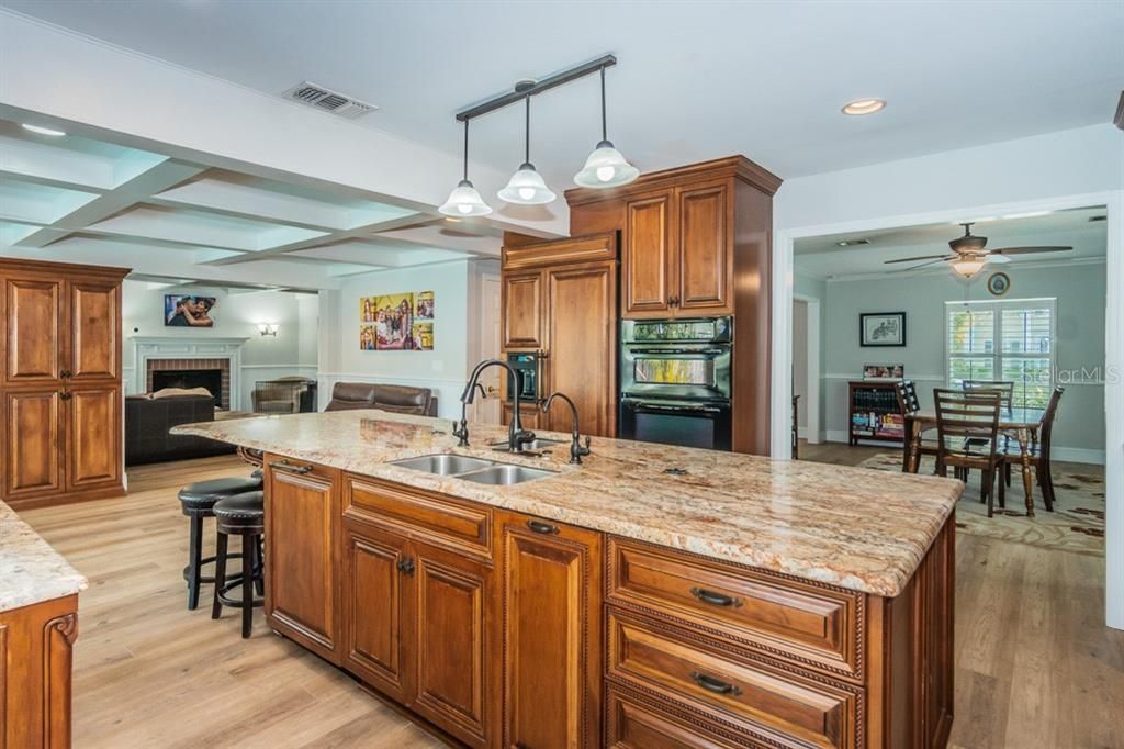 The kitchen connects to the living and dining areas of the home.