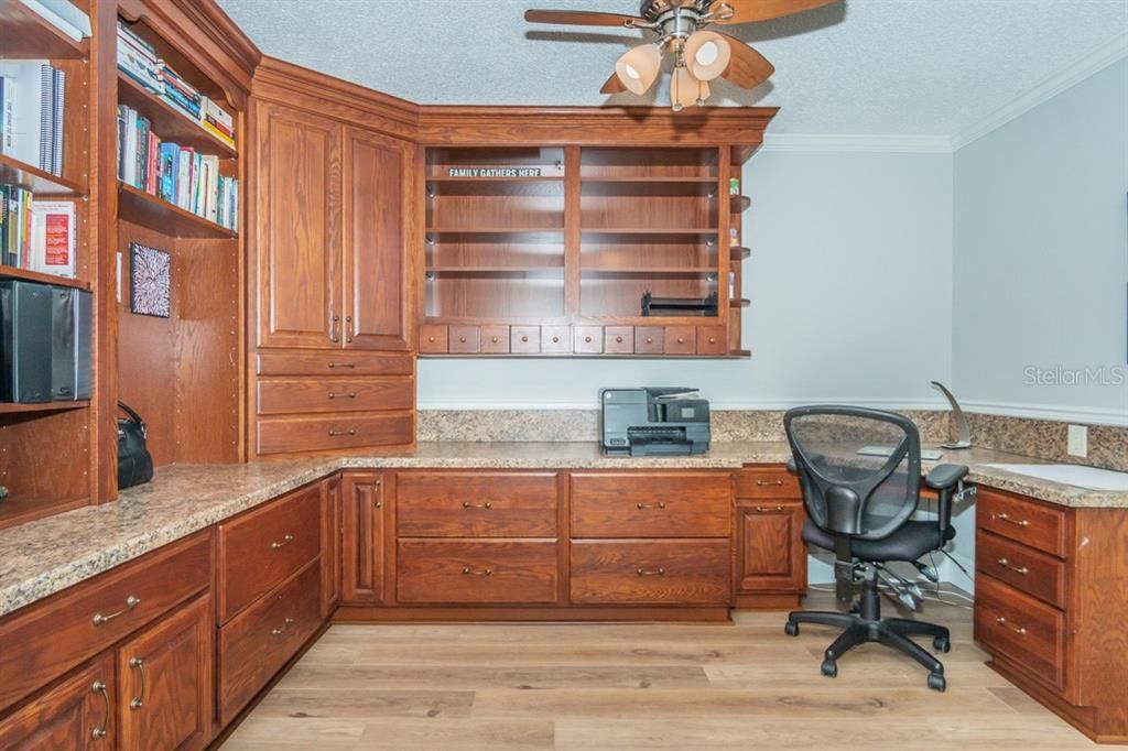 Executive office on the first floor - this is not one of the 5 bedrooms. This room is located at the front of the home and creates a private work space away from the living area.