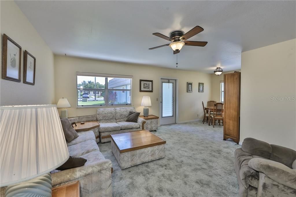 Large windows allow lots of Florida sunshine in.  This unit is move-in ready!