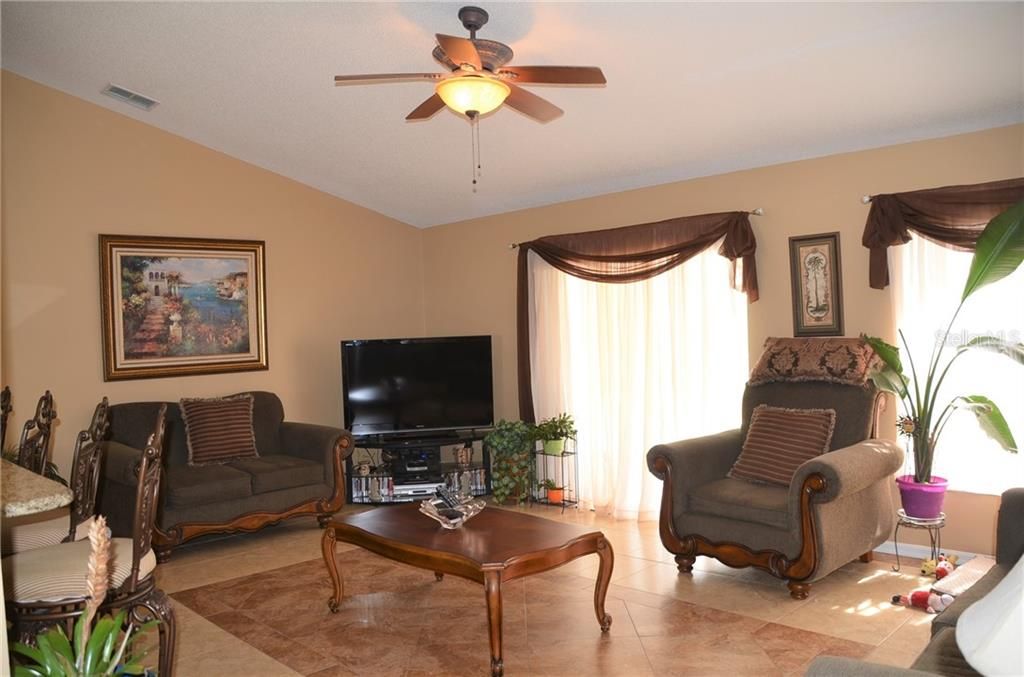 Spacious Great Room Has Sliding Doors To The Lanai And Screened Pool