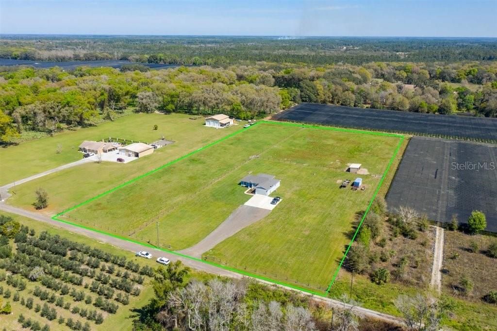 Ariel view of this home on 5 acres including 2 fully fenced pastures