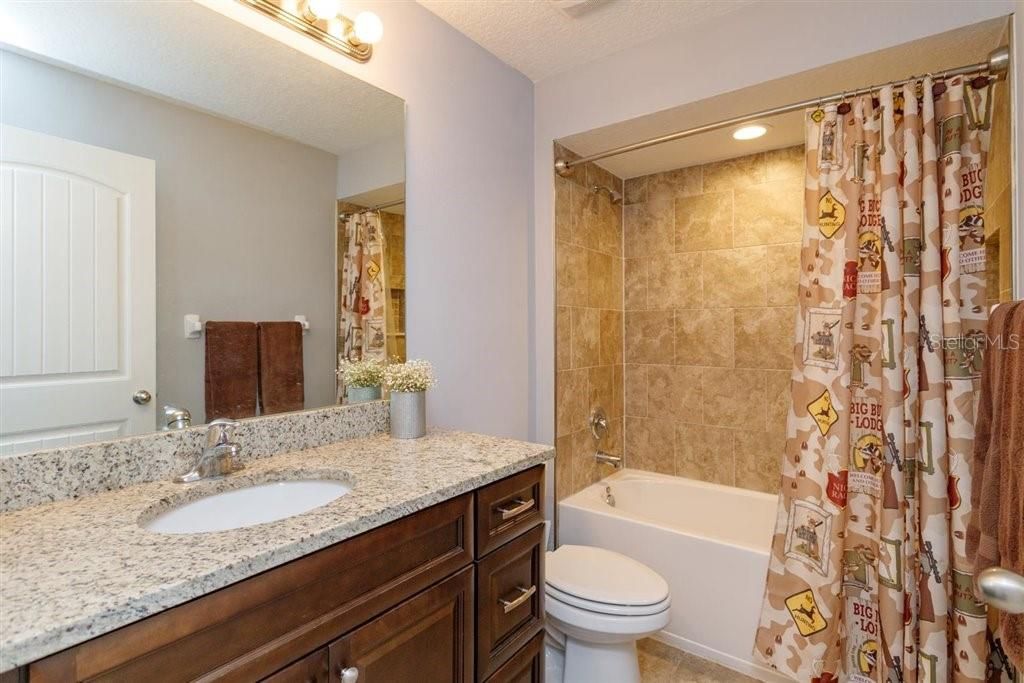 Guest bathroom with granite counter tops