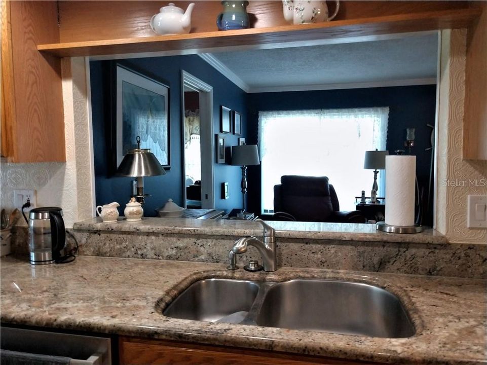 Pass thru into Florida room is great when entertaining.  Kitchen has a deep, stainless sink.