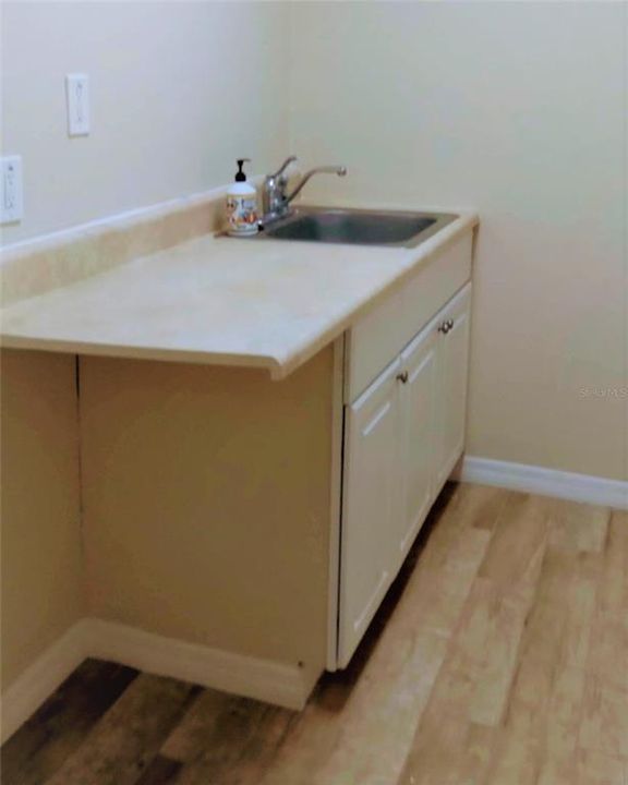 Kitchen with room for refrigerator.