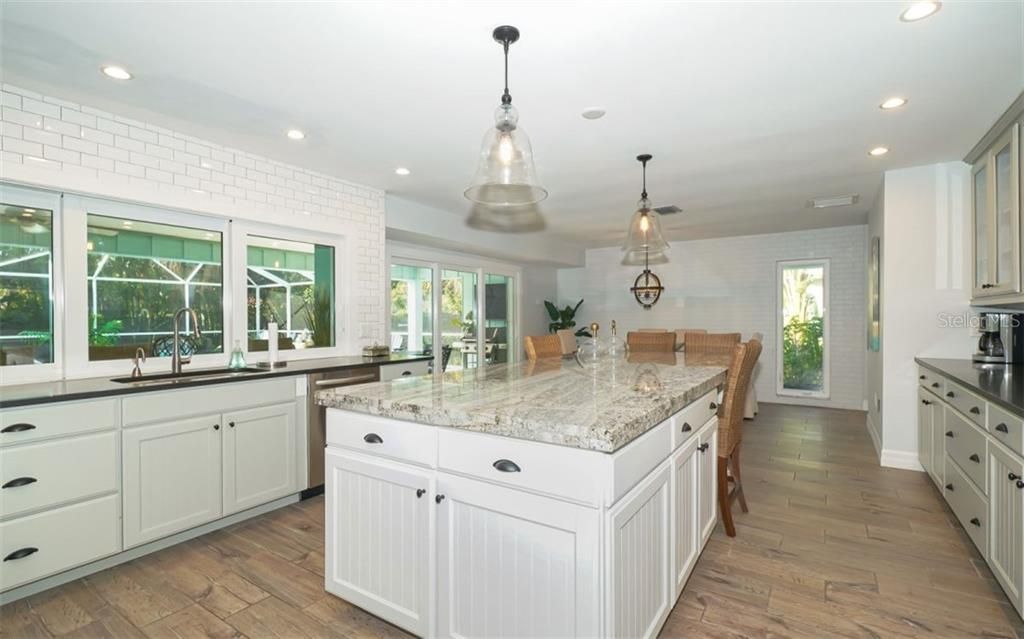 Kitchen looks out on pool