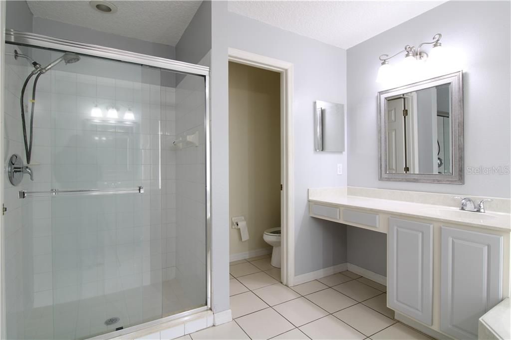 Modern shower and enclosed toilet room