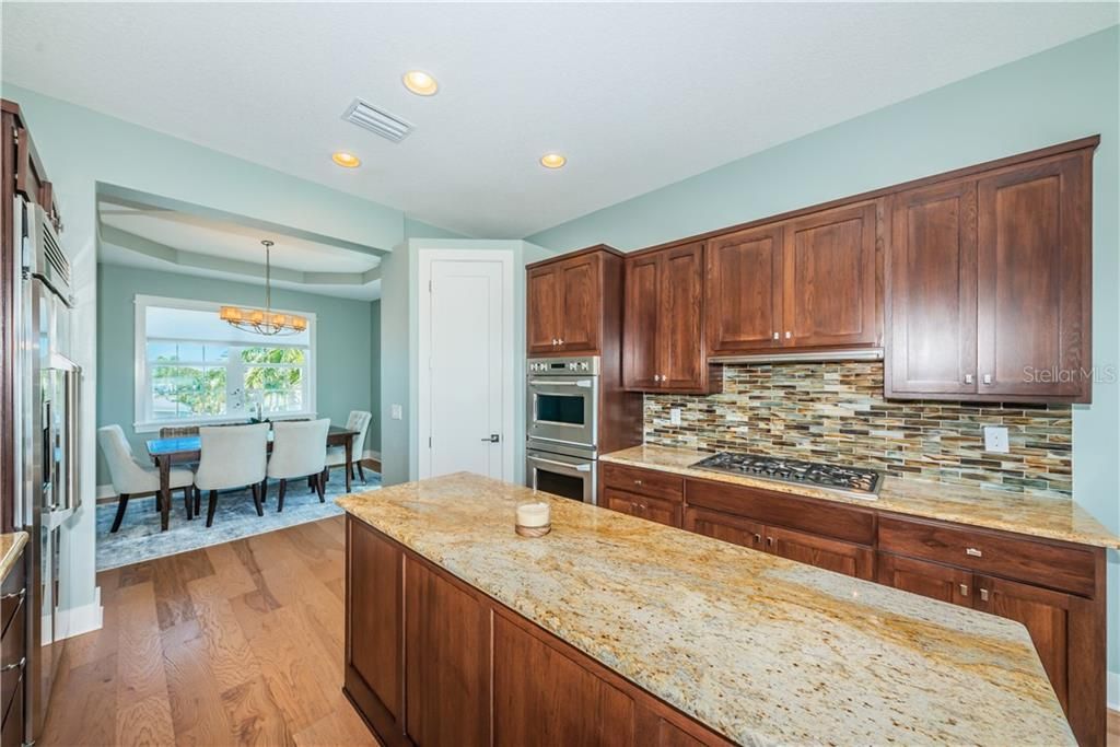 Built in refrigerator, walk in pantry and open access to the formal dining space.