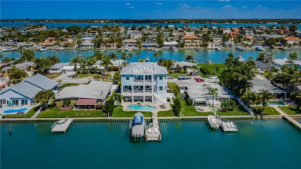 Beautiful Key West style home surrounded by water.
