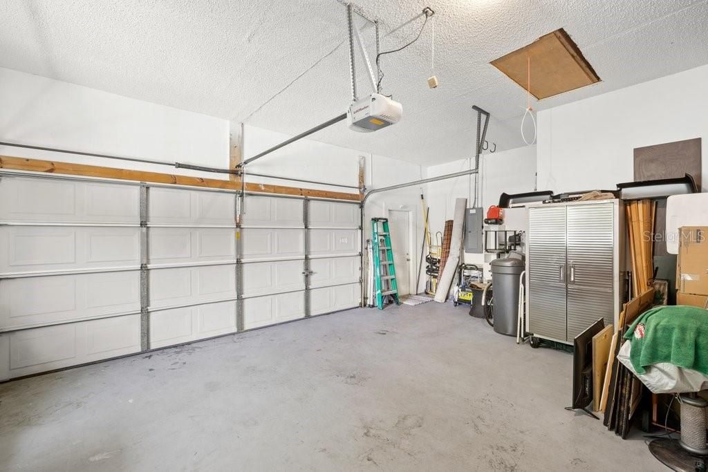 Over-sized 2 bay garage with pull down for easy access to the attic