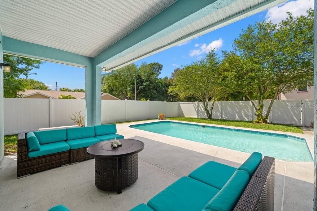 Relax by the pool and private yard with newer vinyl fence enclosure.