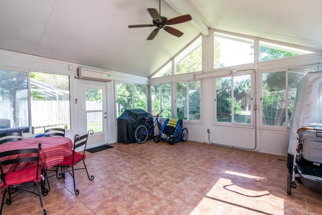 Extended sunroom with separate AC unit.  Perfect for playroom or Work From Home