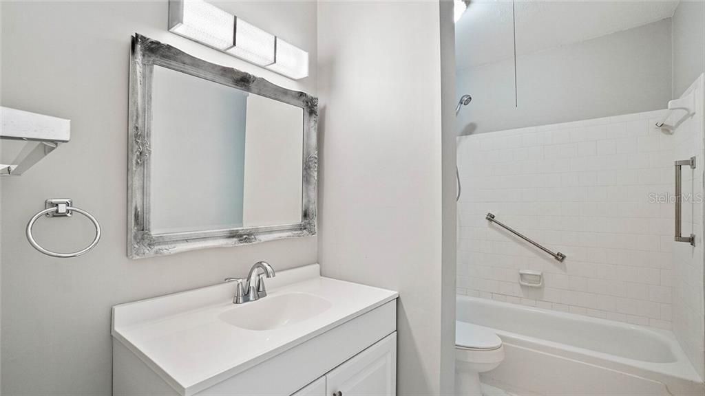 Guest bathroom, updated vanity, light fixture, and hardware