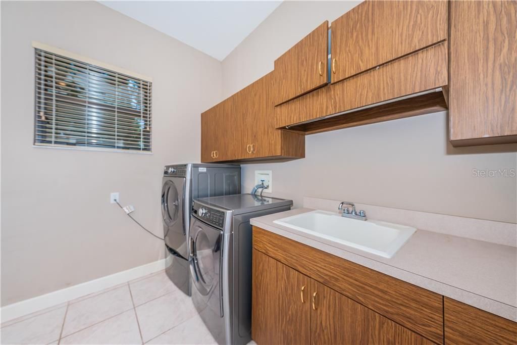 Large laundry room with new Washer/Dryer.