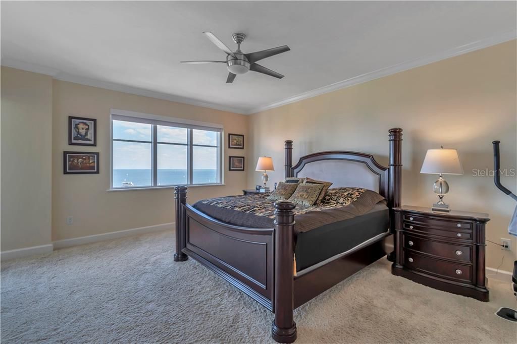 Master bedroom with unobstructed views of the water