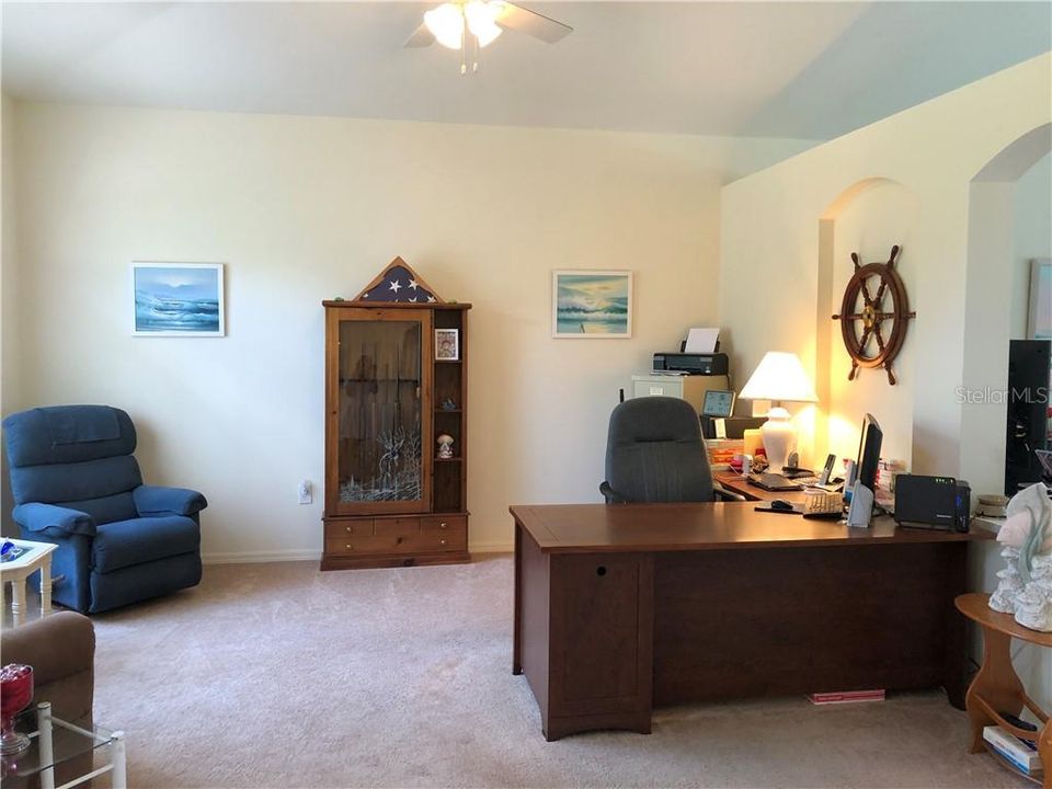 Formal Living Room currently used as an office/den