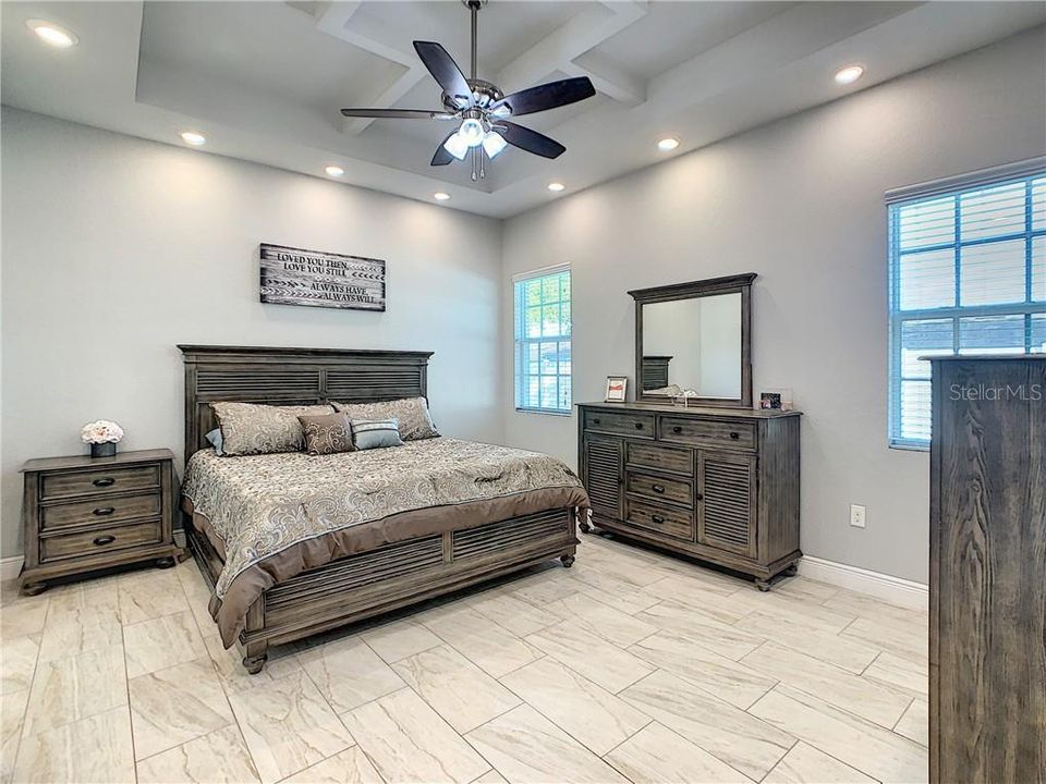 Spacious Master Bedroom with high ceilings and recessed lighting