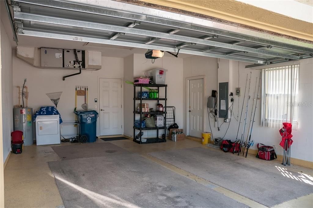 The attached two-car garage has a service door and window.