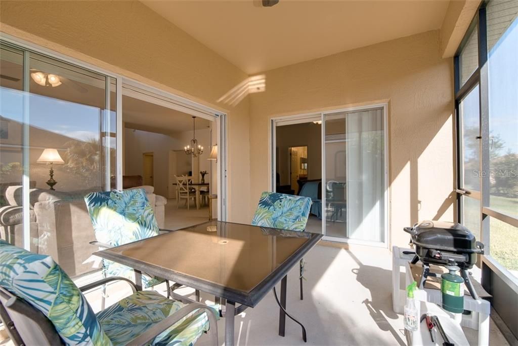 The covered and screen lanai is accessed from the living room and master bedroom.