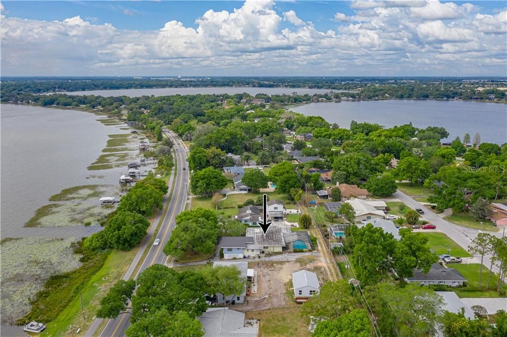 AERIAL VIEW OF HOUSE. LOOKING TOWARDS THE WEST. LAKE HOWARD IS ON THE LEFT.  LAKE CANON IS CENTER AND LAKE MIRROR IS TO THE RIGHT. THEY ARE PART OF THE SOUTH CHAIN OF LAKES.