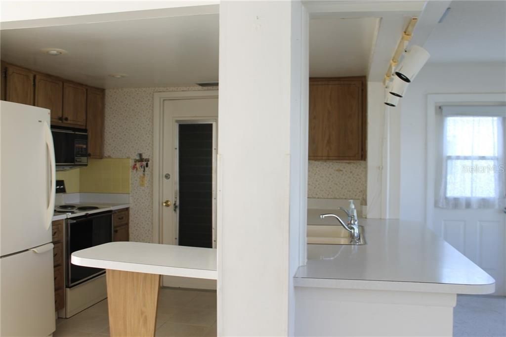 Kitchen with Breakfast Bar to Florida Room