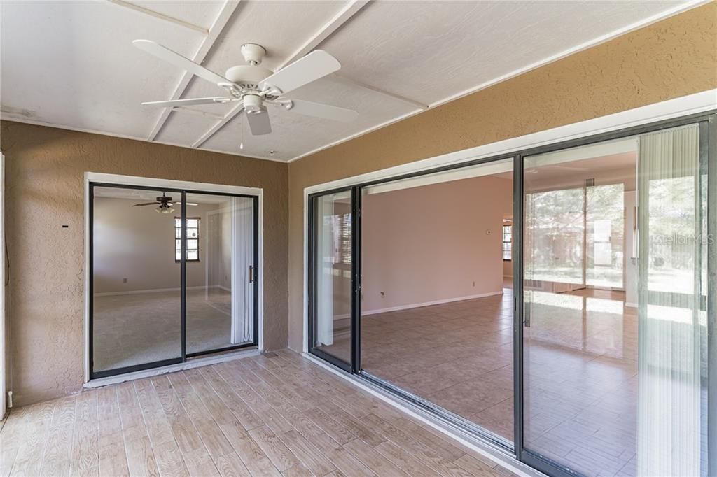 The 16'x10' covered and enclosed lanai features upgraded wood look ceramic tile floors.