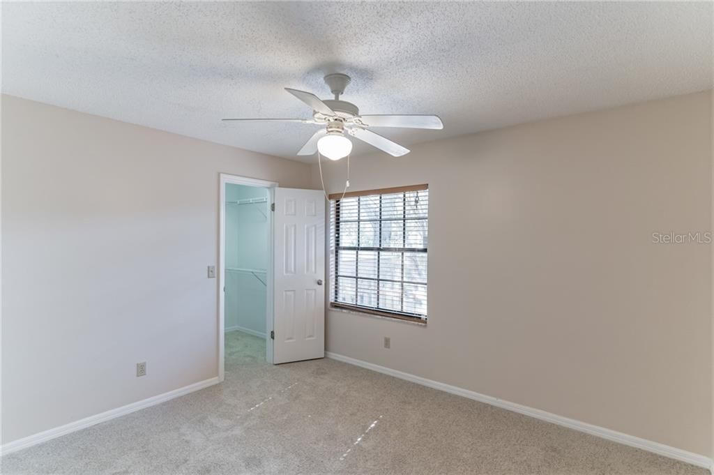 Bedroom 3 overlooks your privately gated courtyard and features brand new carpet, fresh paint and a walk in closet.