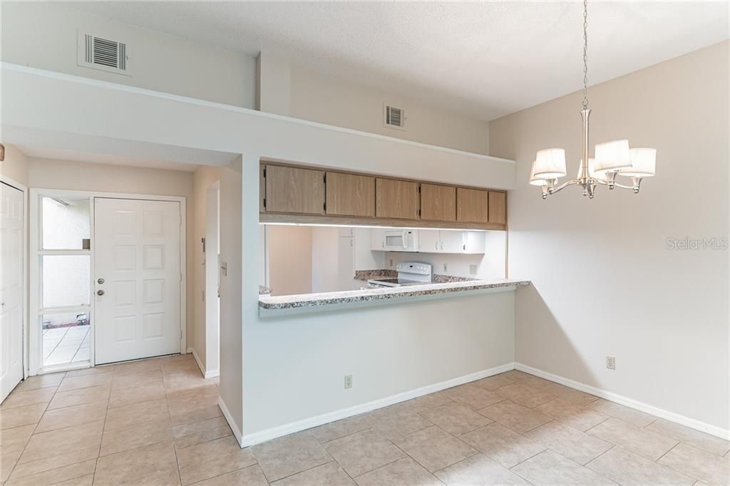 The kitchen open up to the dining room through a breakfast bar adding to the convenience of serving your guests your favorite culinary creations.