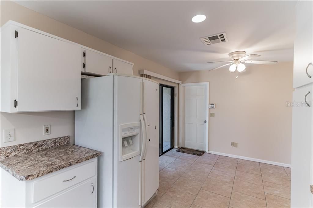 The kitchen features a breakfast nook overlooking your privately gated courtyard.