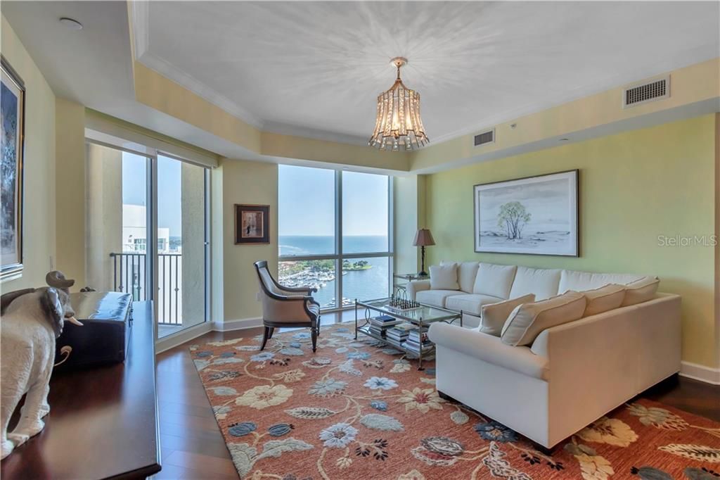 Closer view to the floor to ceiling window overlooking the Tampa Bay and another sliding door to balcony!
