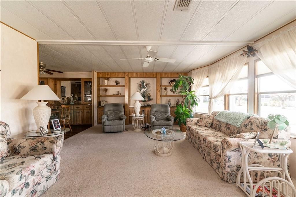 Main Living room has newer carpeting and great space for entertaining.