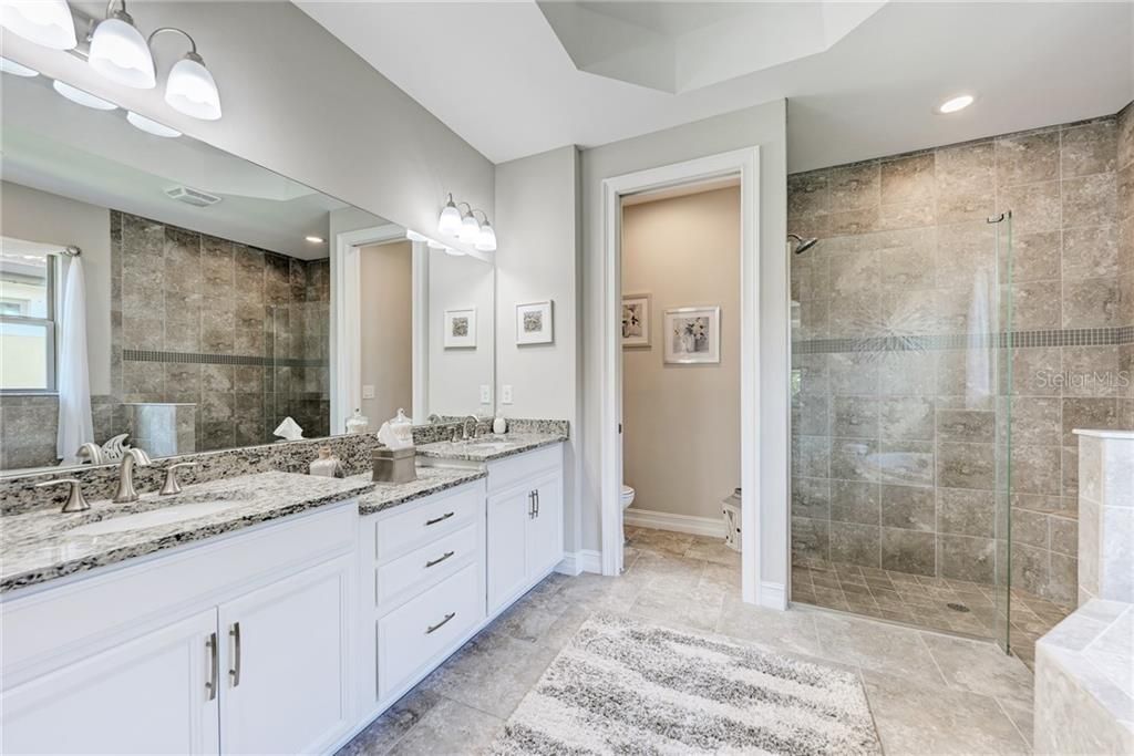 MASTER BATHROOM WITH DUAL SINKS, WALK IN SHOWER, AND SEPARATE WATER CLOSET