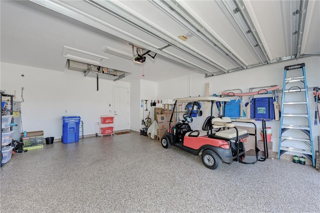ORGANIZED GARAGE FOR BEACH CHAIRS AND STORAGE AND AN EPOXY FLOOR