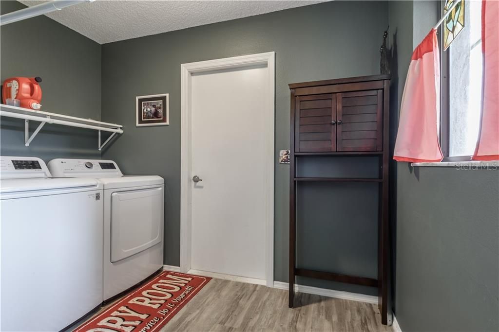 Nice size laundry room with door that leads out to garage