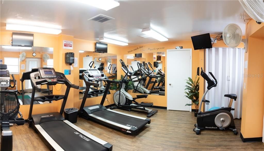 Fitness Rooms Located at the Main Clubhouse (His & Hers Saunas Located in the corresponding Locker rooms on either end).