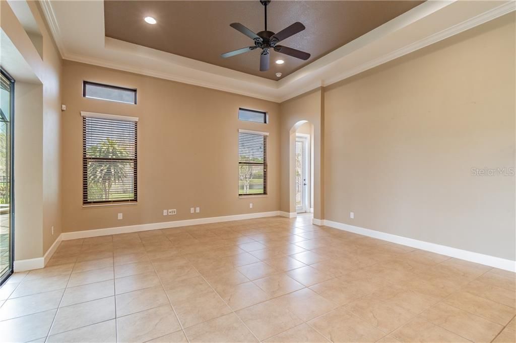 Trayed Ceiling Family Room Open to Kitchen with Transom Windows and Lots of Light