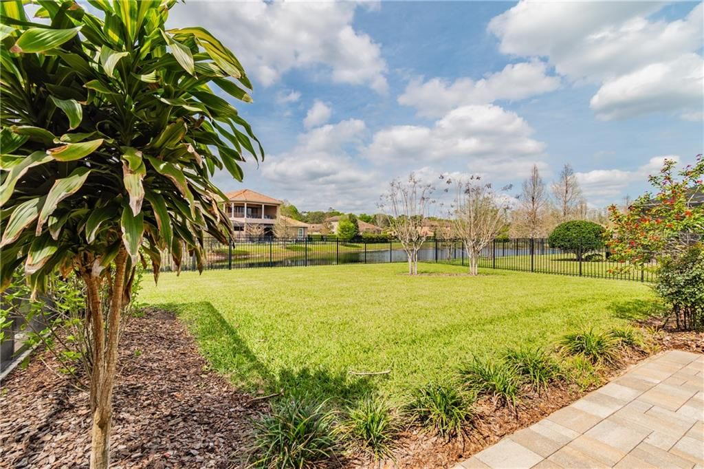 Lushly Landscaped Fenced In Side Yard