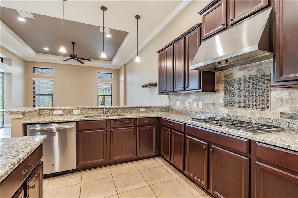 Gourmet Kitchen with 5 Burner Gas Stove. An Abundance of Counter Space and Cabinets.